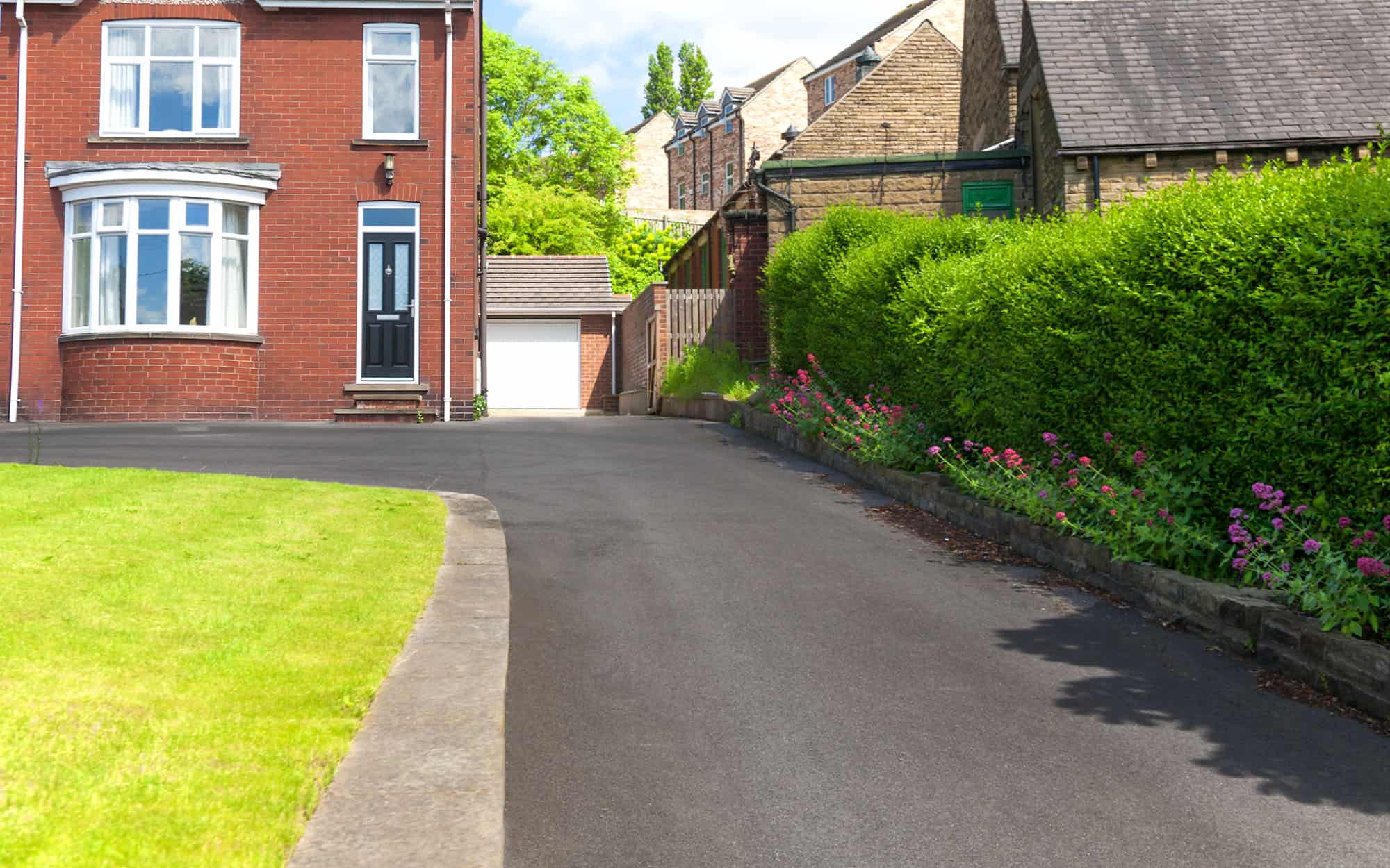 Typical English Single Family House Built Of Red Bricks, With A Large Driveway